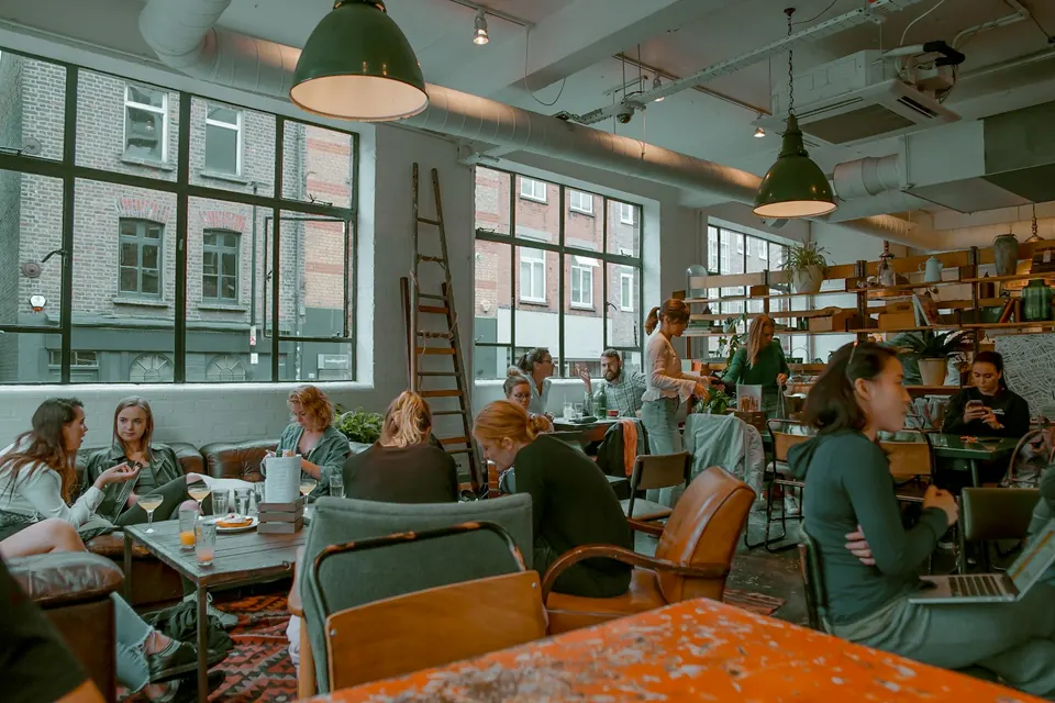 Customers and tables in Barber and Parlour café, London